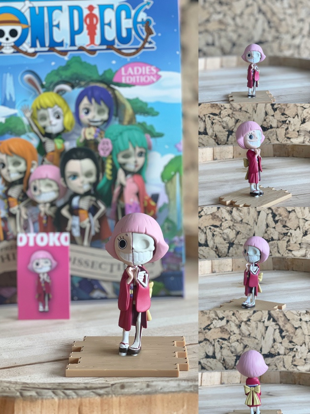A toy figurine on a wooden surface

Description automatically generated
