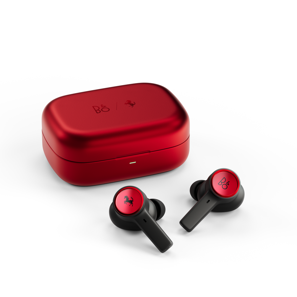 A red box with black earbuds Description automatically generated