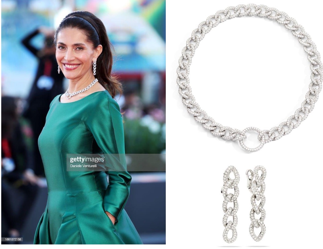 A person wearing a green dress and a necklace and earrings Description automatically generated