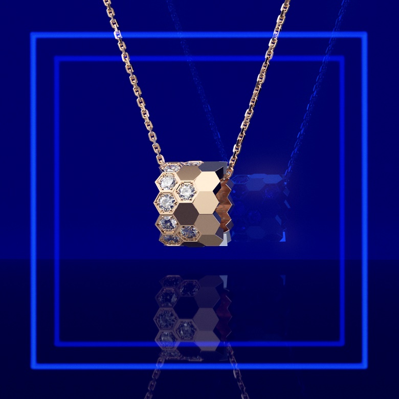 A gold necklace with diamonds and a blue squareDescription automatically generated