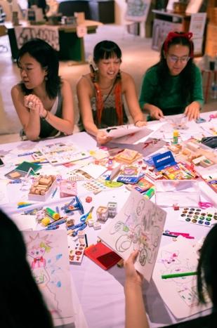 A group of women sitting at a table Description automatically generated