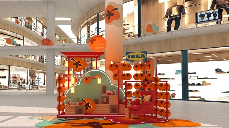 A display of a room with orange decorations Description automatically generated with medium confidence