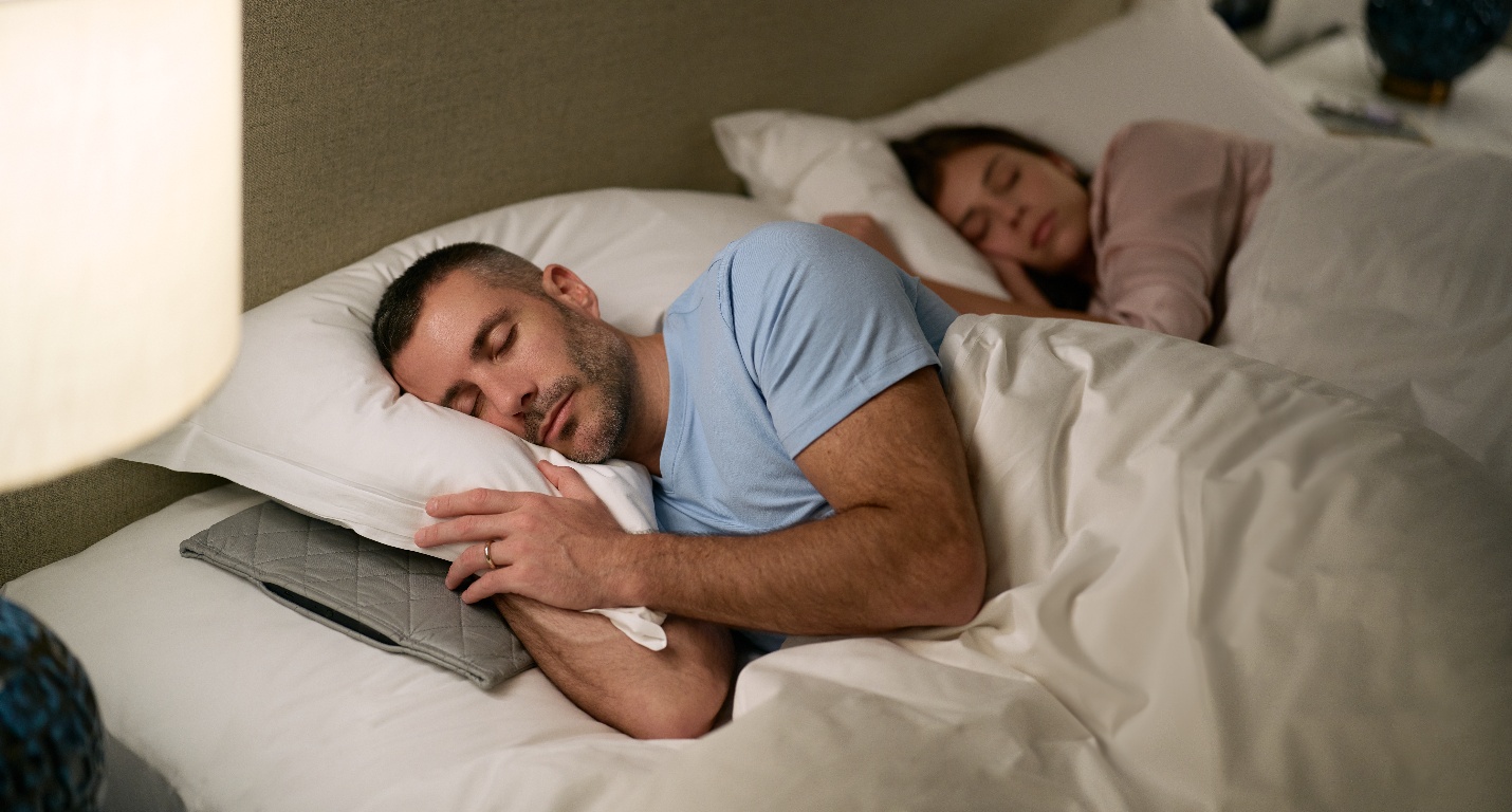 A person and person sleeping in bed

AI-generated content may be incorrect.