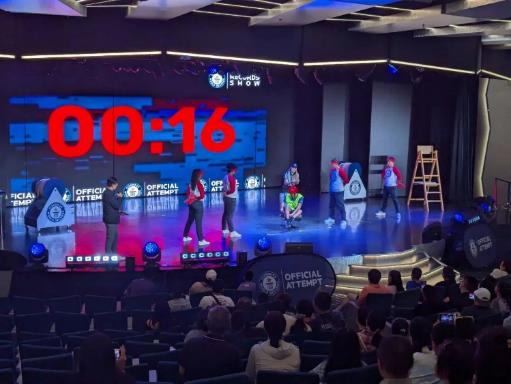 A group of people on a stage AI-generated content may be incorrect.