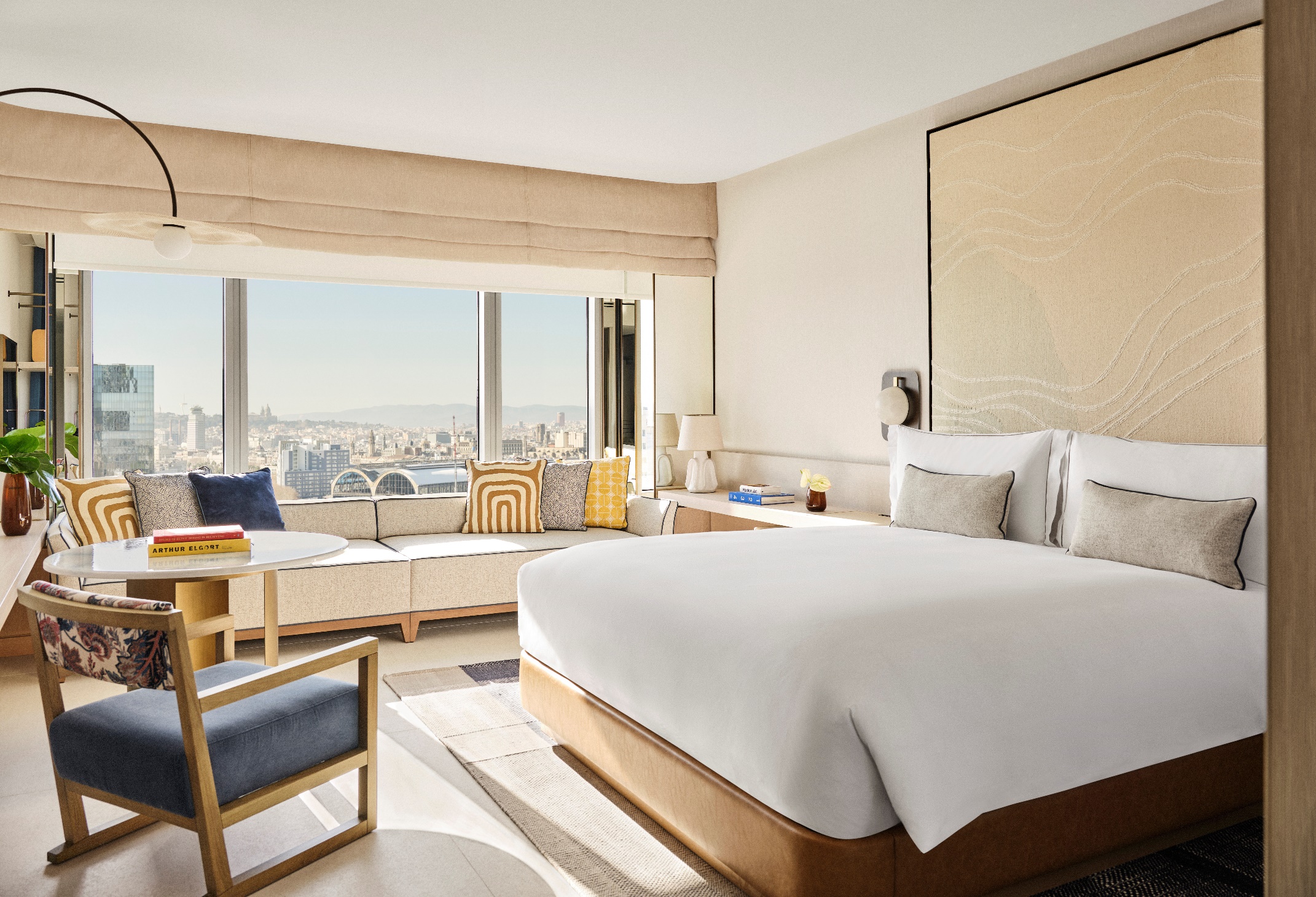 A bedroom with a large bed and a window

AI-generated content may be incorrect.
