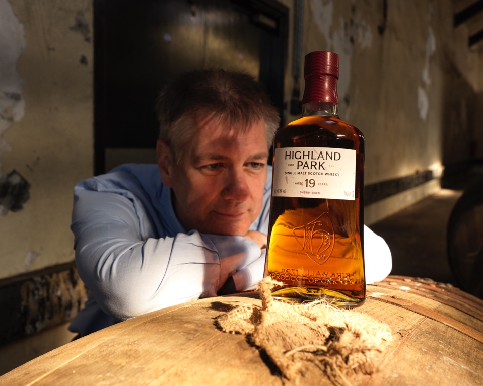 A person sitting at a table with a bottle of alcohol

AI-generated content may be incorrect.