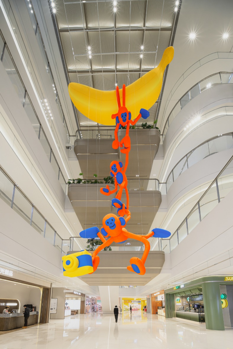 A large orange and blue balloon from a ceiling AI-generated content may be incorrect.