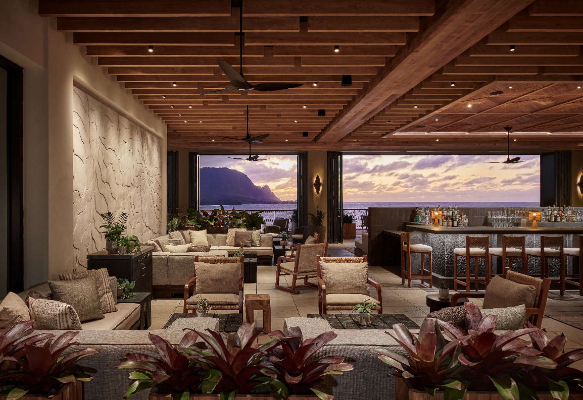 A room with a view of the ocean and a large window AI-generated content may be incorrect.