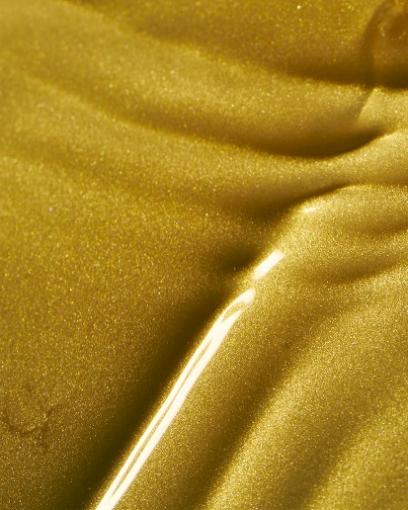 A close up of a gold surface

Description automatically generated