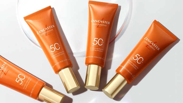 Several sunscreen bottles on a white surface

Description automatically generated