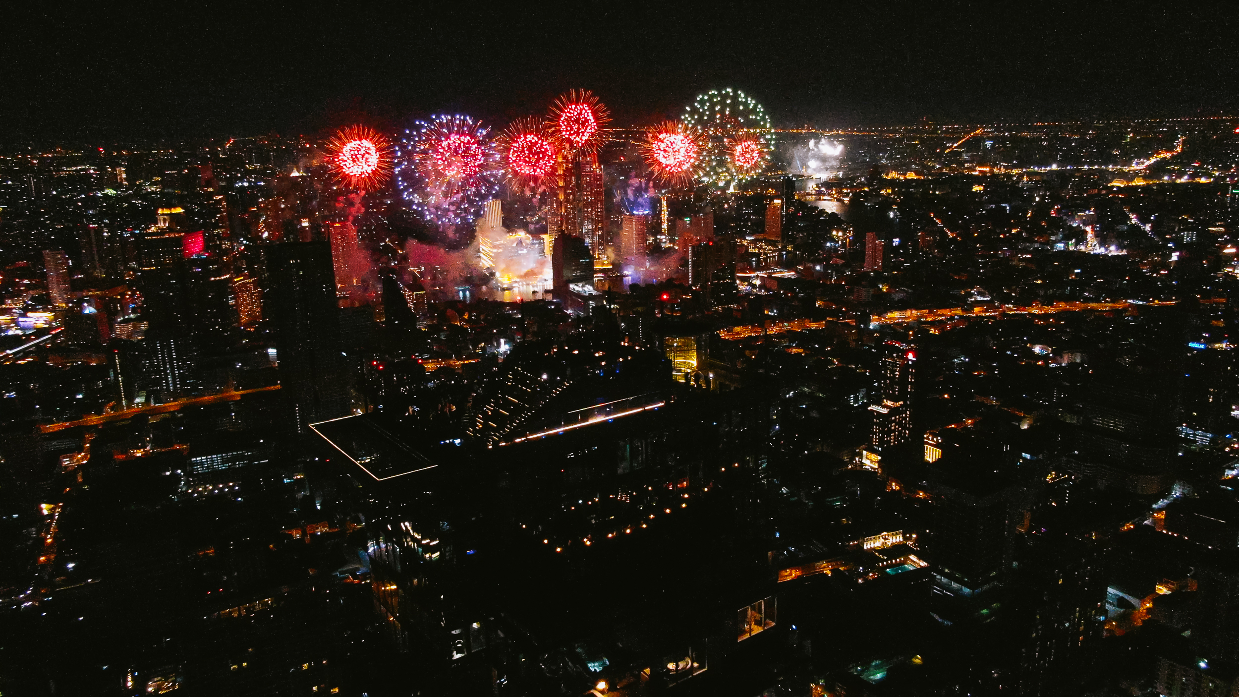 Fireworks in the sky above a city AI-generated content may be incorrect.