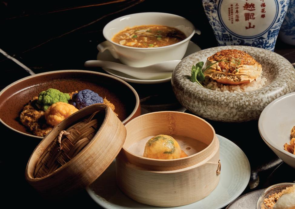 A table with different dishes AI-generated content may be incorrect.