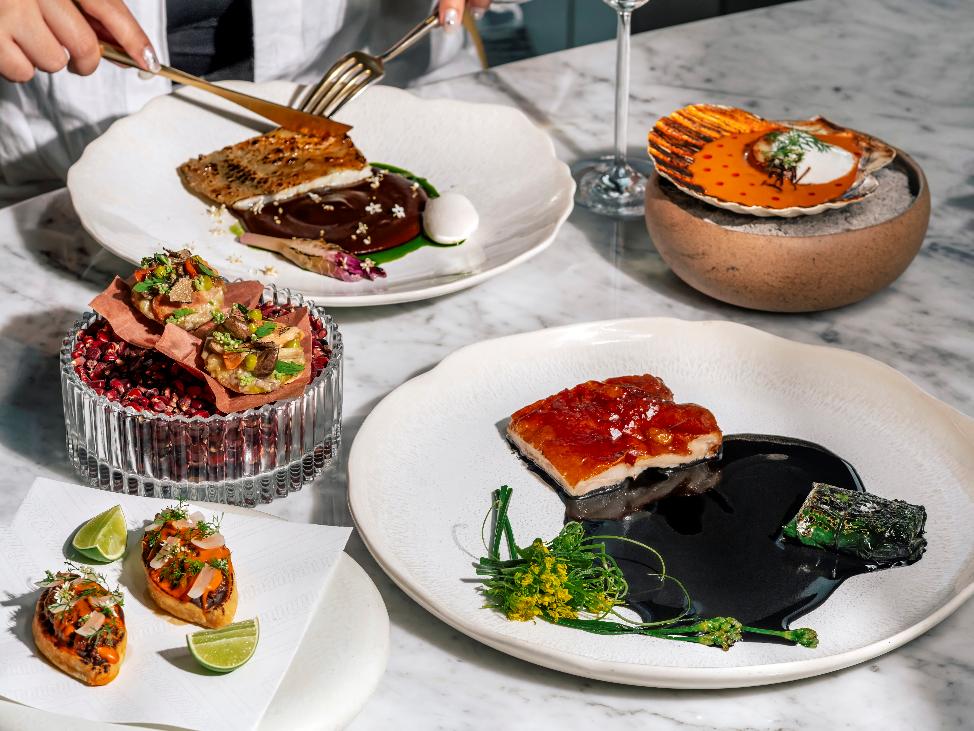 A table with plates of food AI-generated content may be incorrect. 