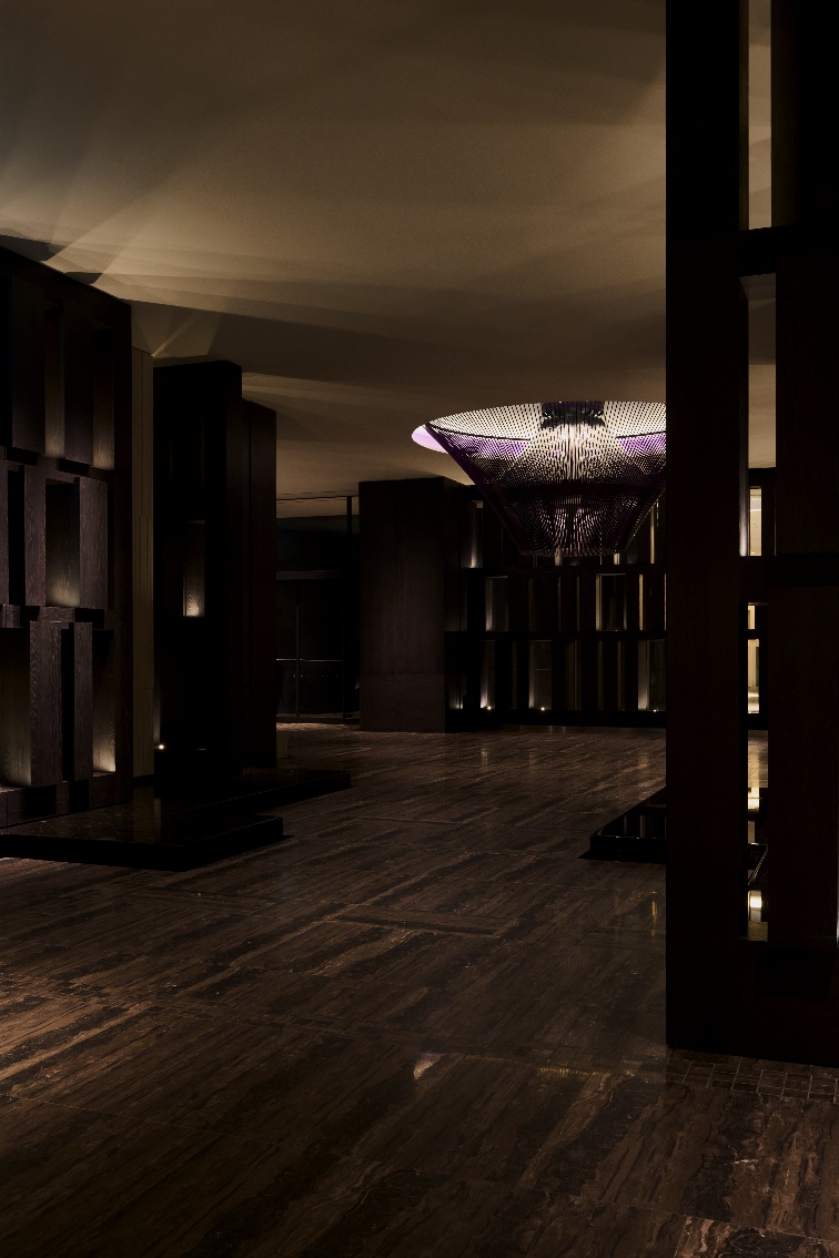 A dark room with a chandelier AI-generated content may be incorrect.