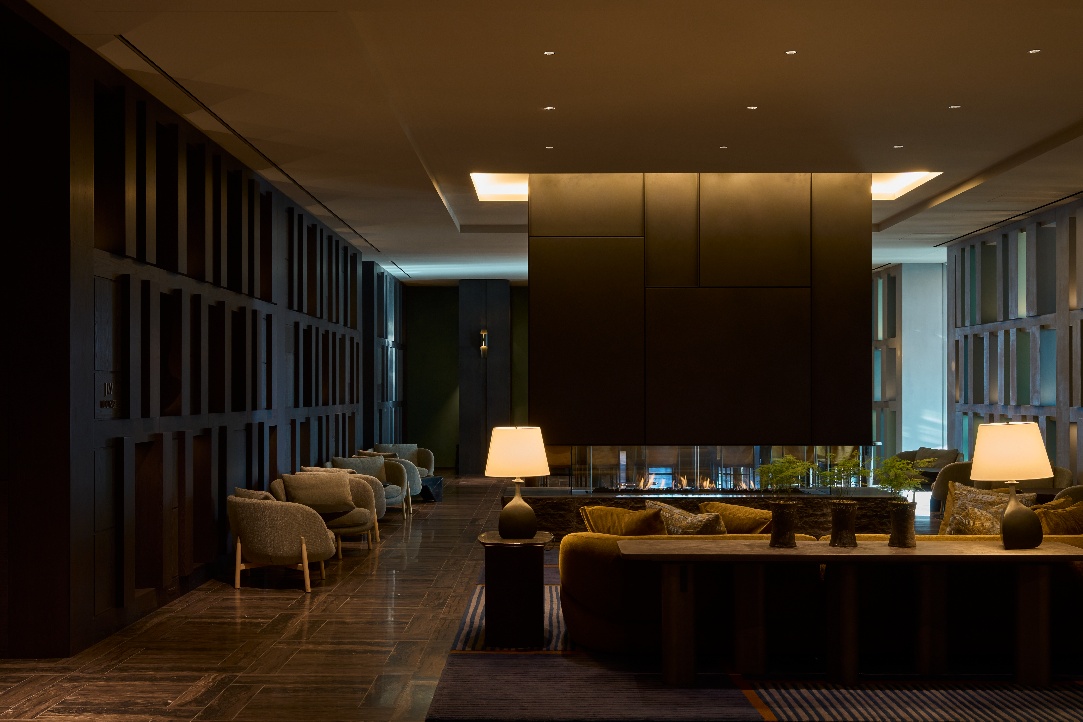 A room with a fireplace and a couch AI-generated content may be incorrect.