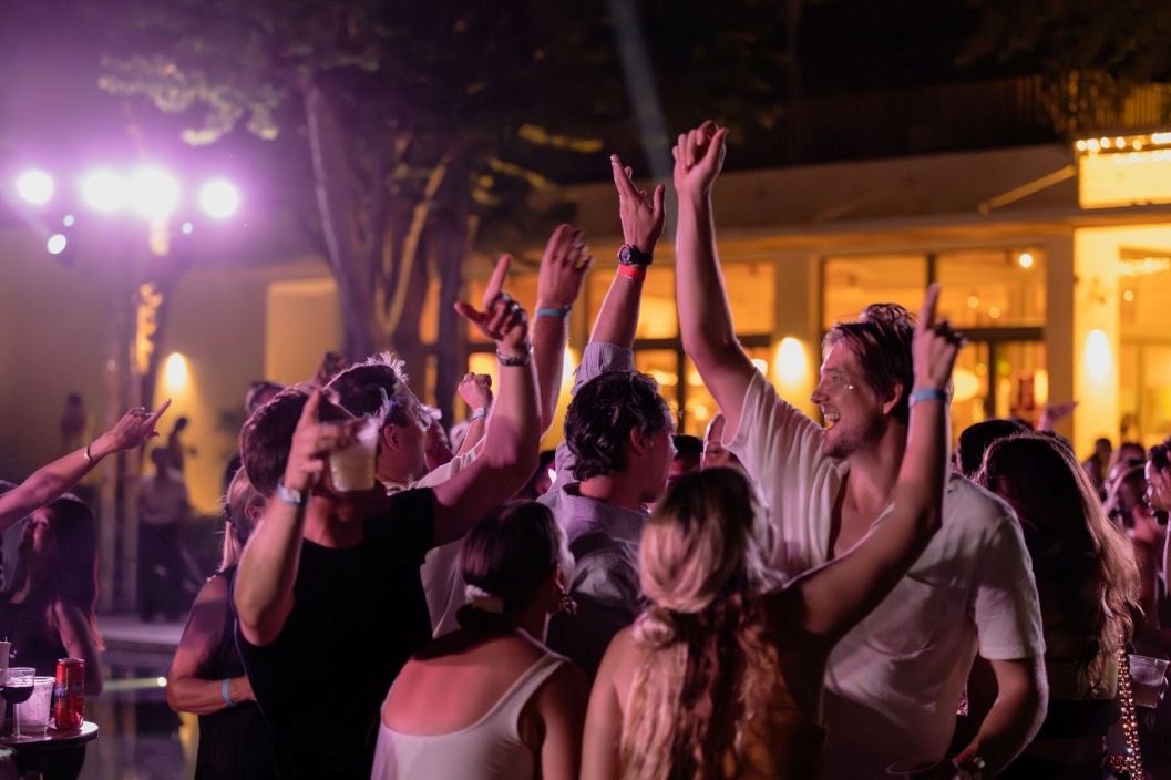 A group of people at a party AI-generated content may be incorrect.