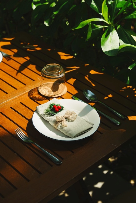 A plate with napkin and fork on a table AI-generated content may be incorrect.